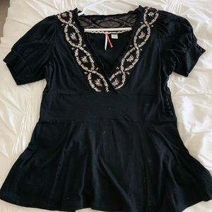 Anthropologie blouse with embroidery.
